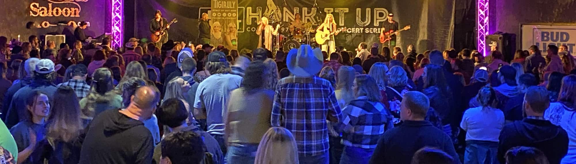 country concert with fans wearing cowboy hats Salt Lake City